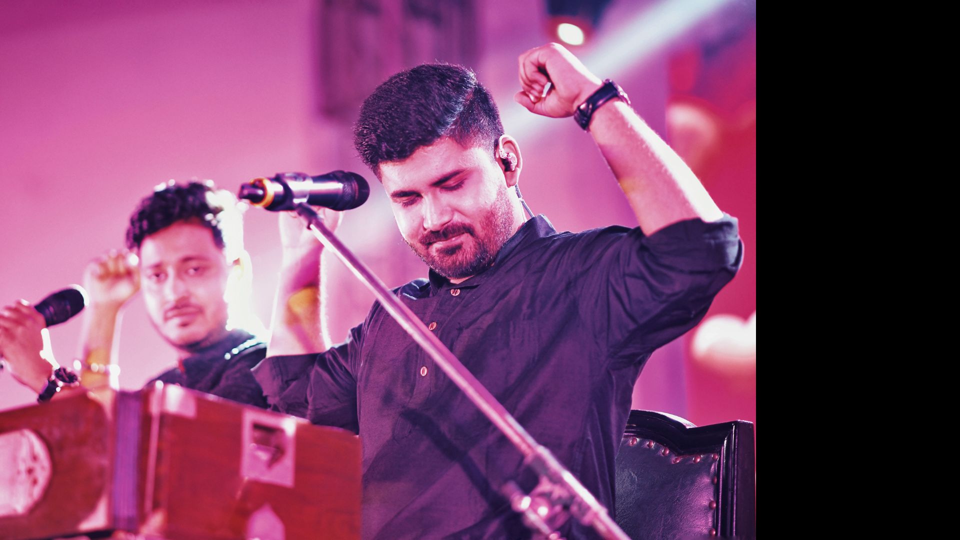 Live performer under magenta stage light