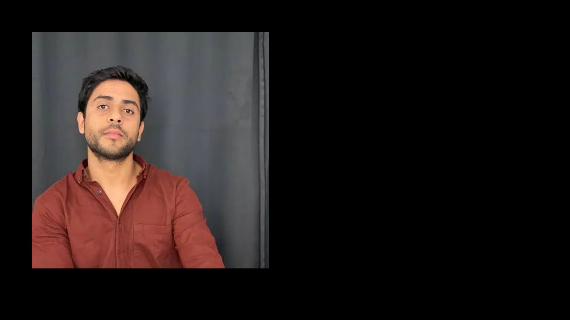 Founder portrait against a dark wall